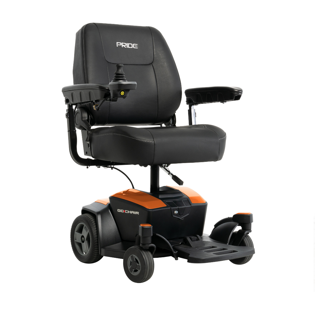 The Pride Mobility Go Chair® Portable Powerchair is a black and orange foldable electric wheelchair with armrests, a padded backrest, right-side joystick controls, four wheels, and the Pride logo on the headrest.